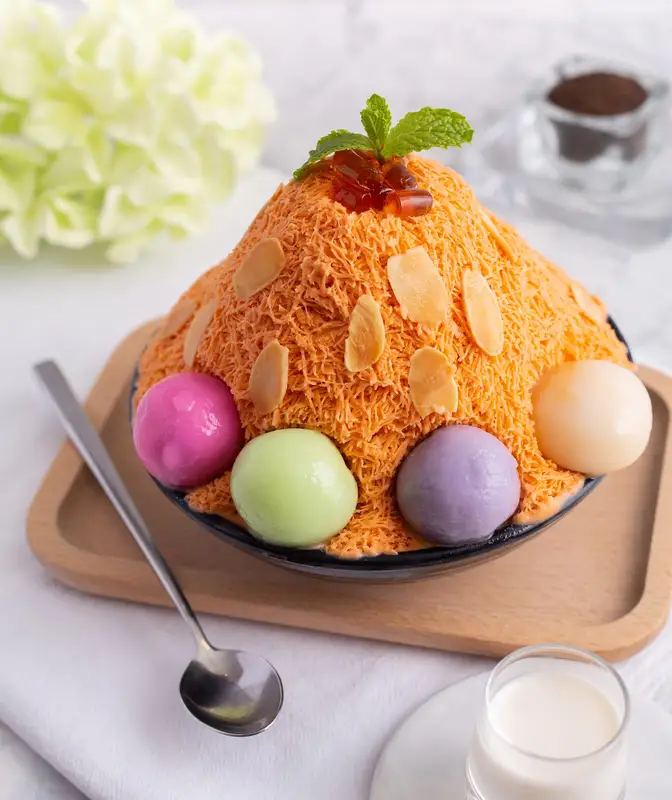 Thai tea bingsu with almonds and coloured bua loy rice balls