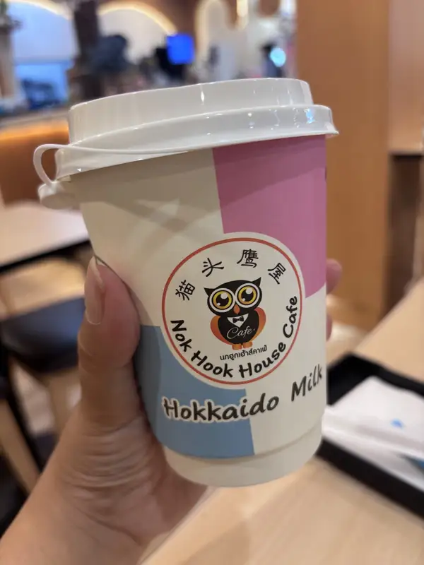 Hokkaido Milk in a Nok Hook House Cafe paper cup