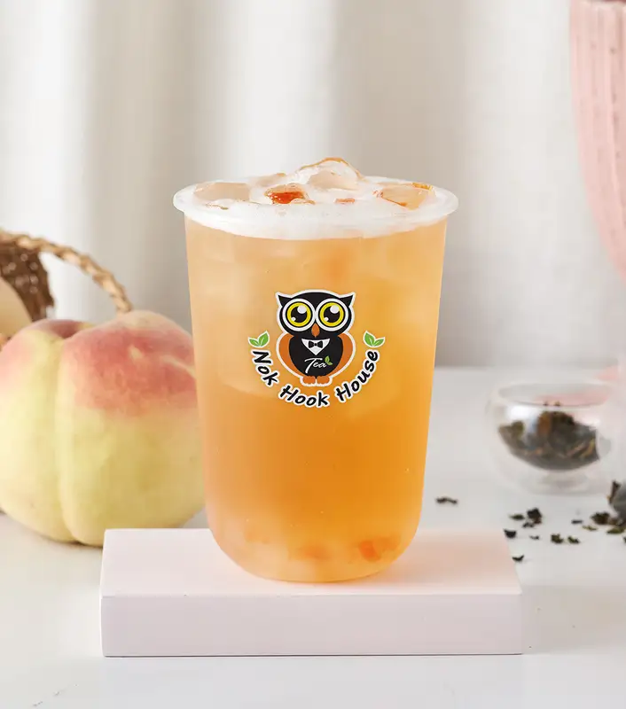 Iced peach tea in a Nok Hook House cup